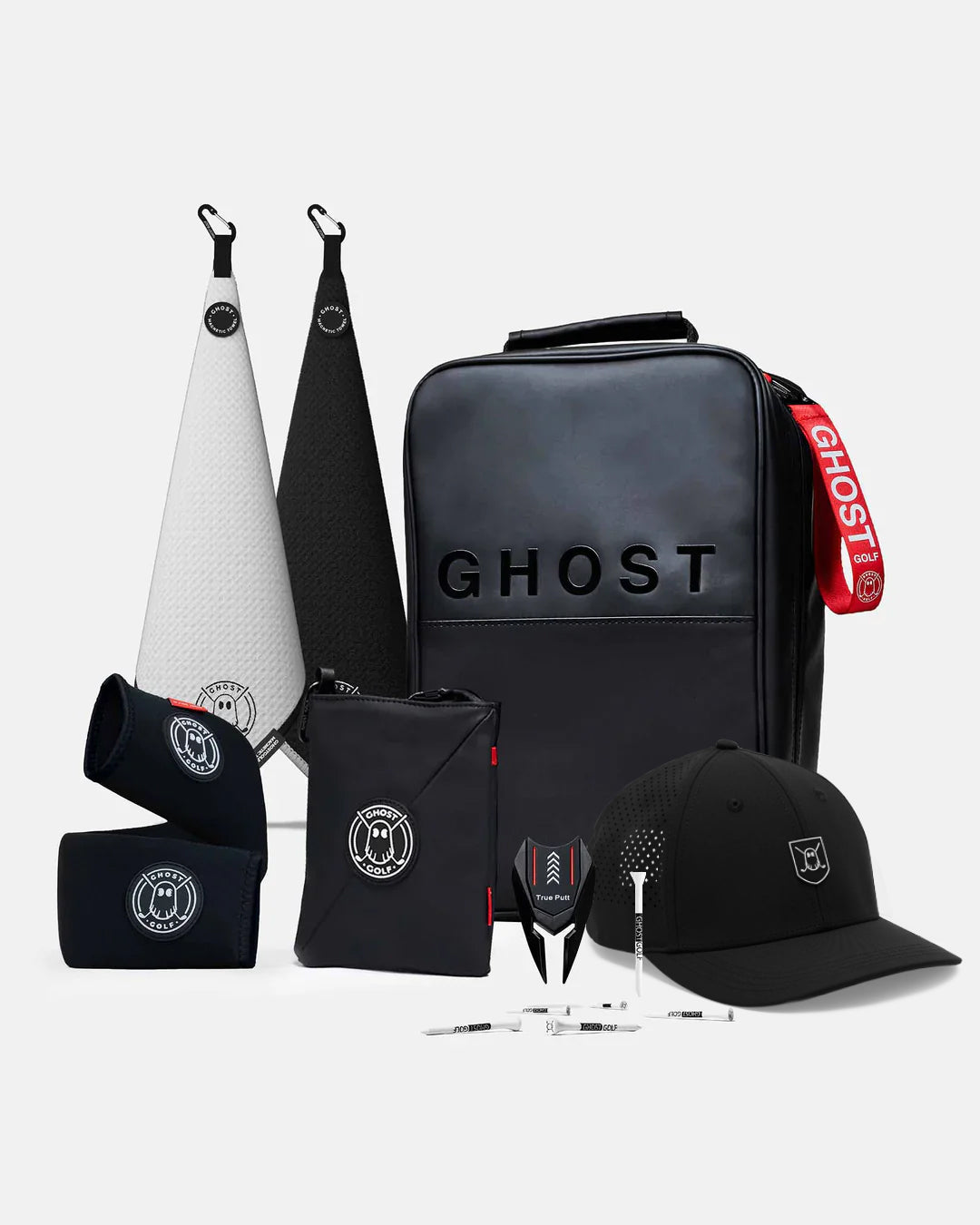 Collection of golf accessories with 'GHOST' branding on a white background