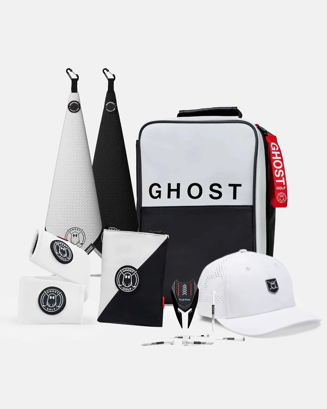 Product Shot of Oreo Bundle showcasing 2 greenside magnetic towels, utility pouch, cart strap sleeve, golf hat, divot tool, and golf tees