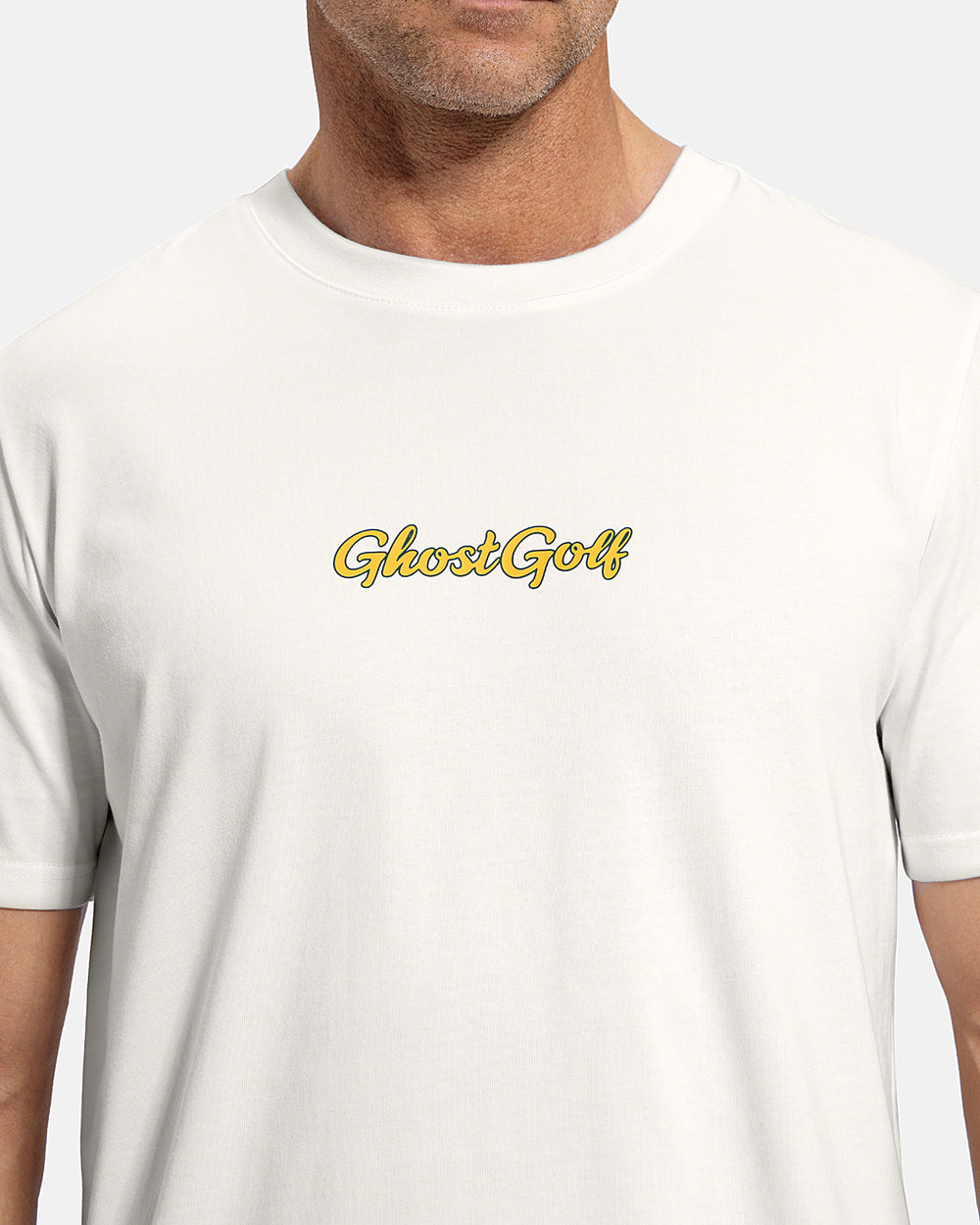 Closeup Front View of White Patrons Azalea Badge Tee on white male model showing ghost golf graphic hit #color_white