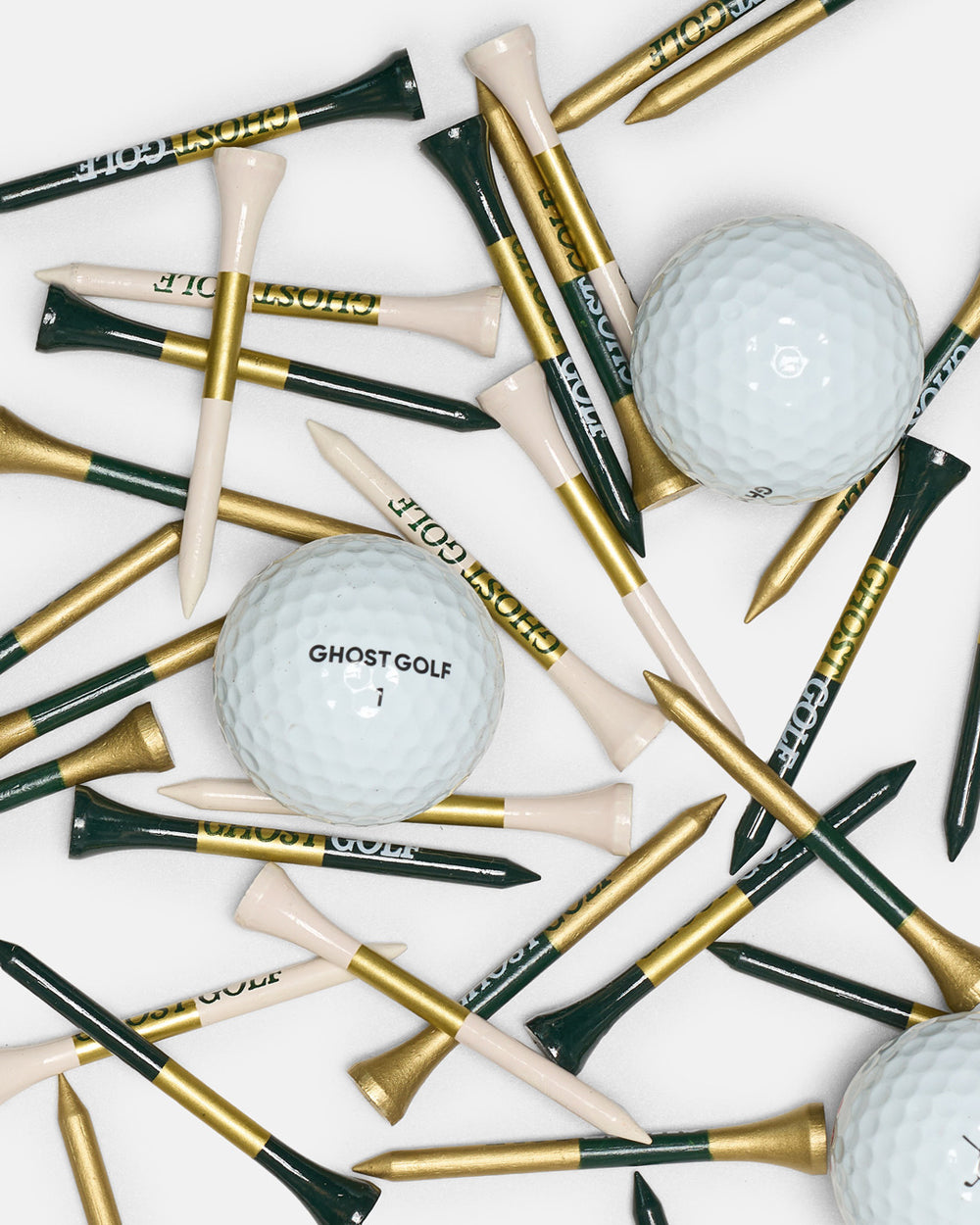 Product Shot of Patrons Only golf tees and golf balls in white background. In green gold and white colors