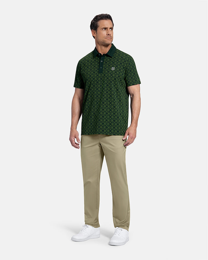 Full Body Front View of Sand Patrons Pleated Pant on white male model wearing green polo and white shoes  #color_sand