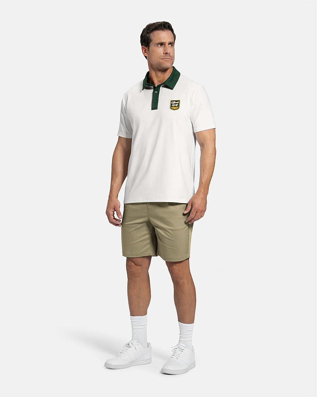 Full Body Front View of White Patrons Signature Polo on white male model wearing beige shorts and white shoes #color_white
