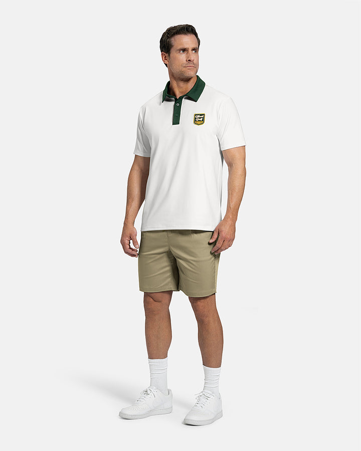 Full Body Front View of White Patrons Signature Polo on white male model wearing beige shorts and white shoes #color_white