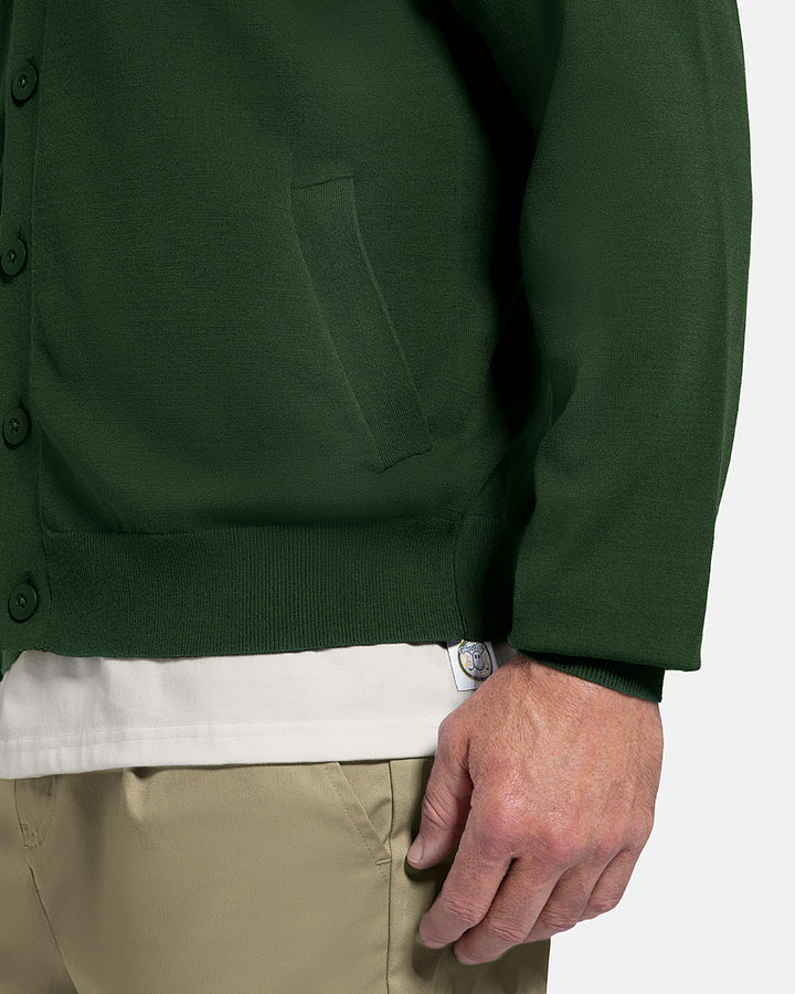 Closeup Side View of Bogey Green Patrons Sweater Cardigan on white male model #color_bogey-green