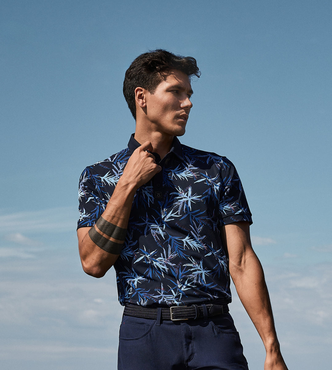 Polo_Collection_Tile_Vertical_Apparel_3_Man Wearing Floral Pattern Polo
