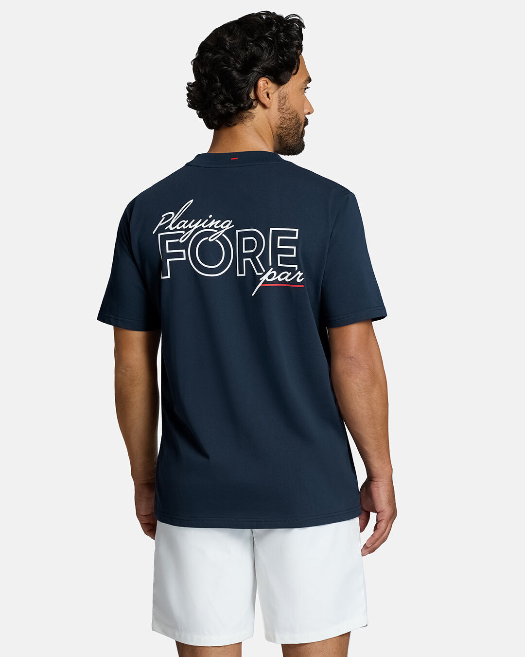Top Back Body Shot of White Male Model Wearing Dark Navy Qualifier Fore Par Tee show casing typographic design on the back. Model is wearing white shorts #color_dark-navy