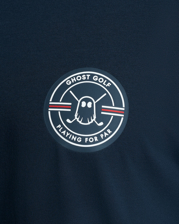 Closeup Shot of Dark Navy Qualifier Fore Par Tee showcasing emblem artwork on chest #color_dark-navy