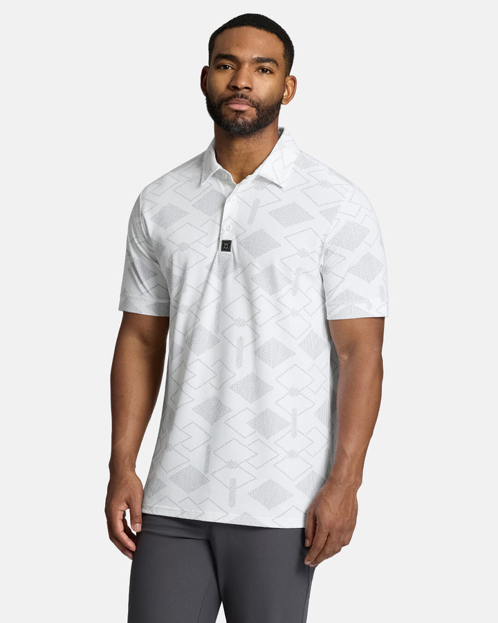 Top Front Body Shot of Black Male Model Wearing White Qualifier Chase Polo with grey pants. Polo is untucked #color_white