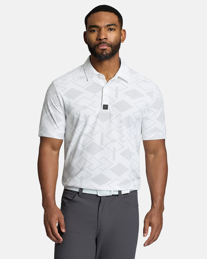 Top Front Body Shot of Black Male Model Wearing White Qualifier Argyle Polo with grey pants and white belt. Polo is tucked in shorts #color_white