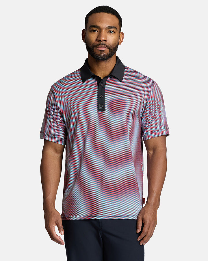 Top Body Front Shot of Black Male Model Wearing Red Qualifier Diamond Polo with navy pants. Polo is untucked. #color_red