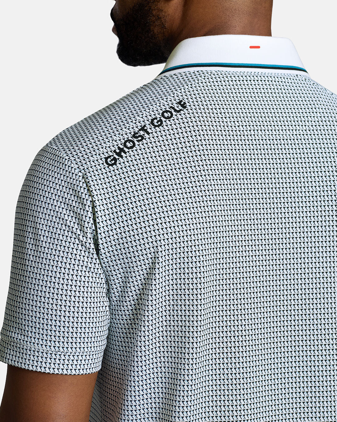 Closeup Back Shoulder Shot of White Qualifier Grid Flag back of the polo showcasing ghost golf hit on left back shoulder #color_white
