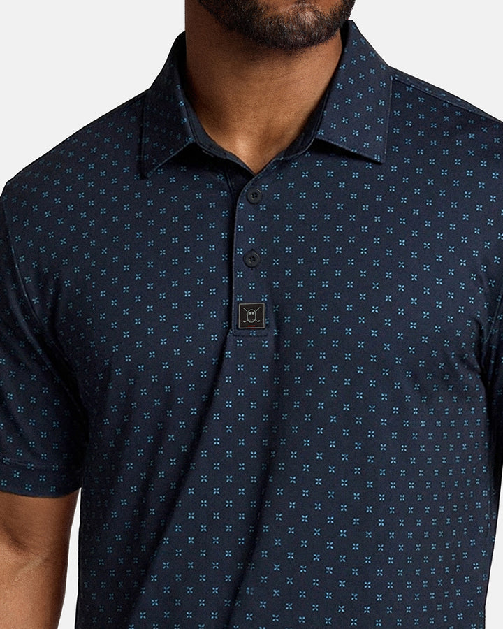 Closeup Front Shot of Navy Qualifier Geo Polo showcasing buttons of polo and ghost golf icon #color_navy