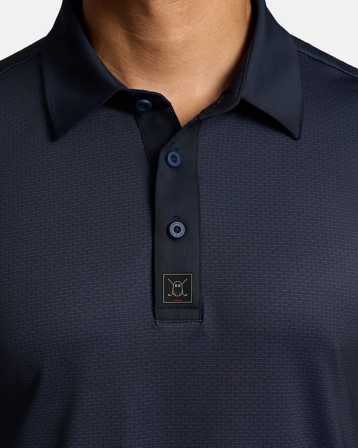 Closeup Front Shot of Dark Navy Qualifier Grid Polo showcasing buttons of polo and ghost golf icon #color_dark-navy