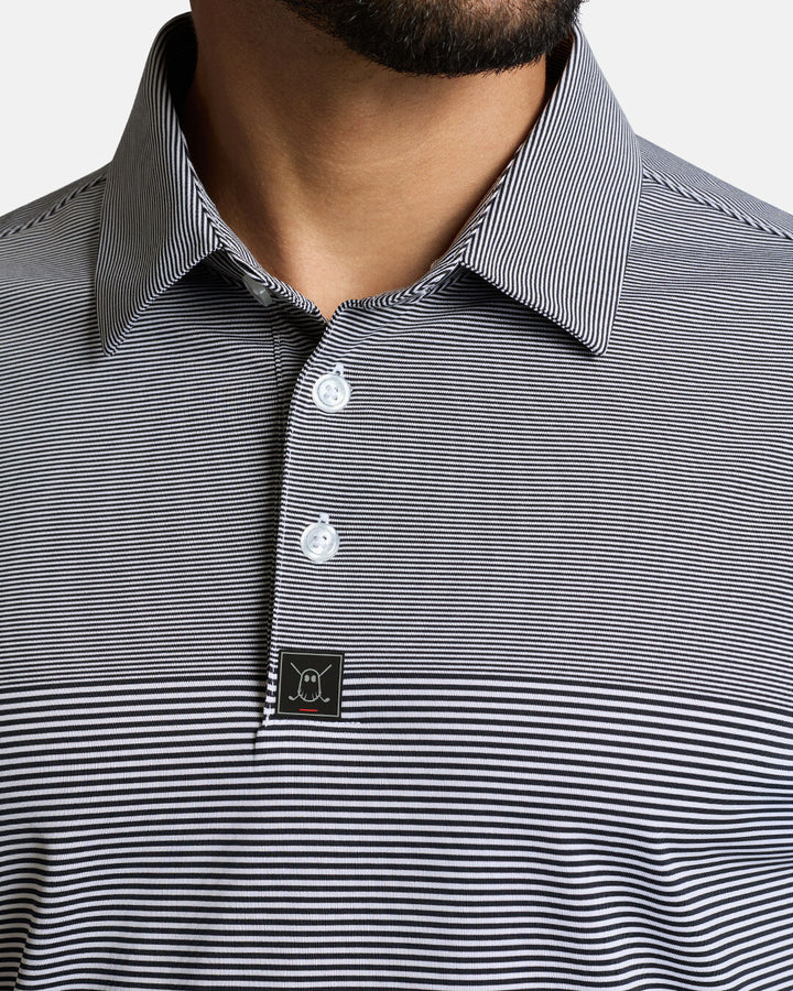 Closeup Front Shot of White Qualifier Stripe Polo showcasing buttons of polo and ghost golf icon #color_dark-navy