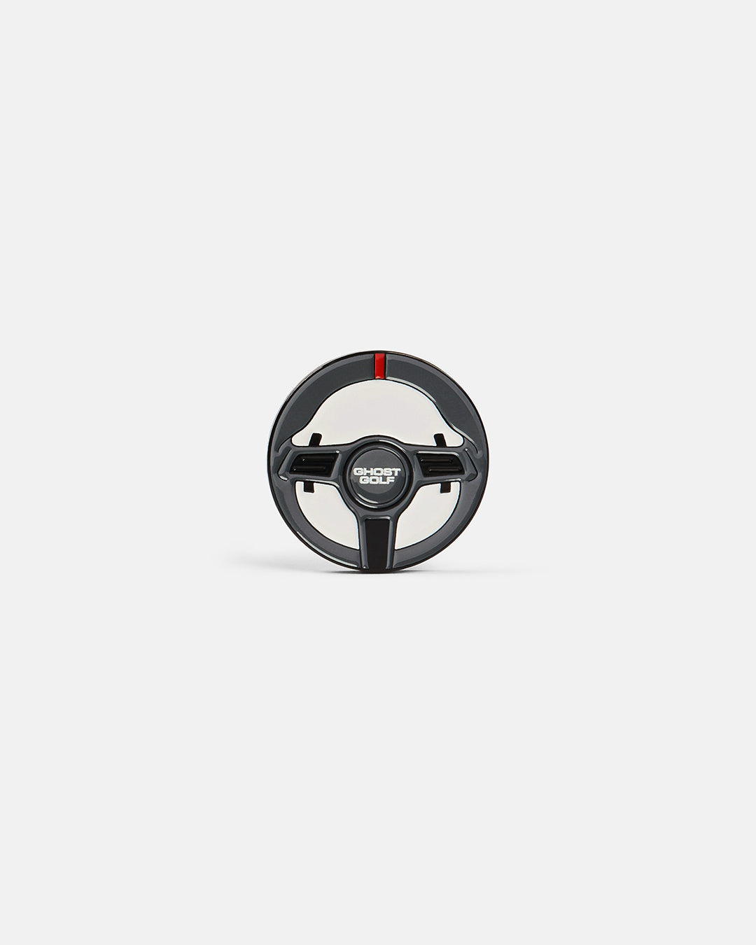 Product photo of a ball marker featuring a racing wheel design with the word “Ghost Golf.”