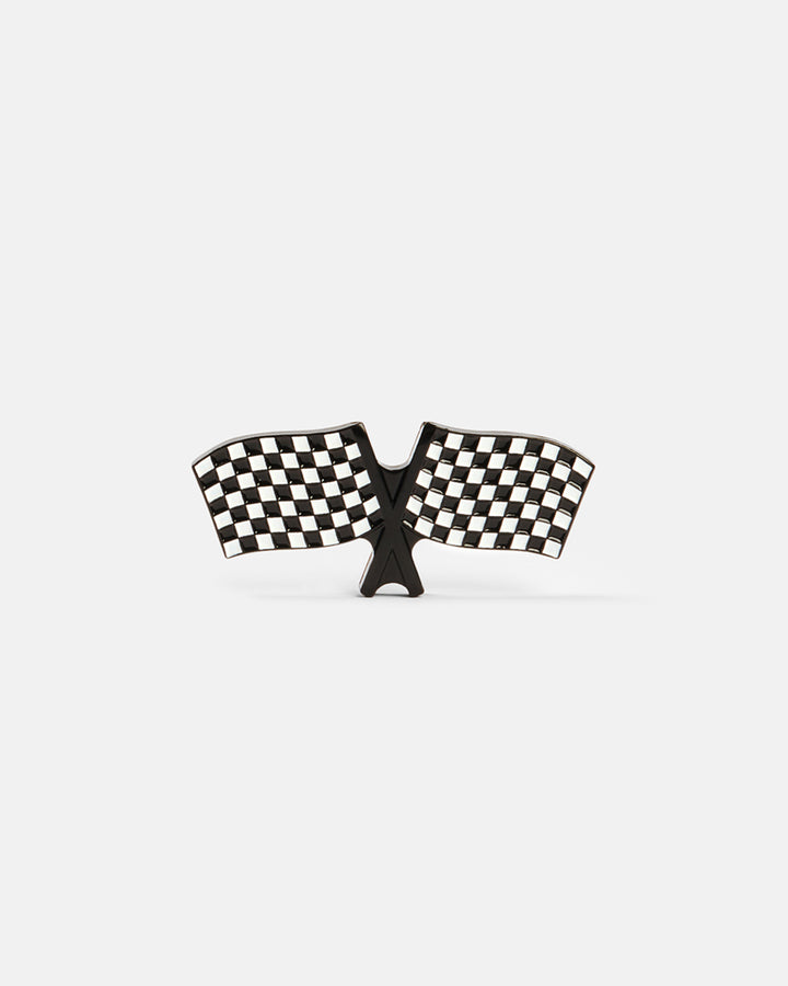 Product photo of a ball marker shaped like checkered racing flags.