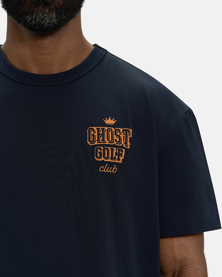 Front Closeup View of Navy Spectator Club Tee on Black Male Model with Ghost Golf #color_navy