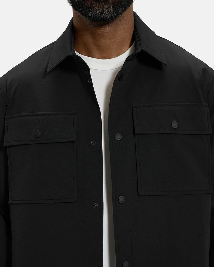 Front Closeup View of Black Spectator Collared Shirt Jacket on Black Male Model with Ghost Golf #color_black