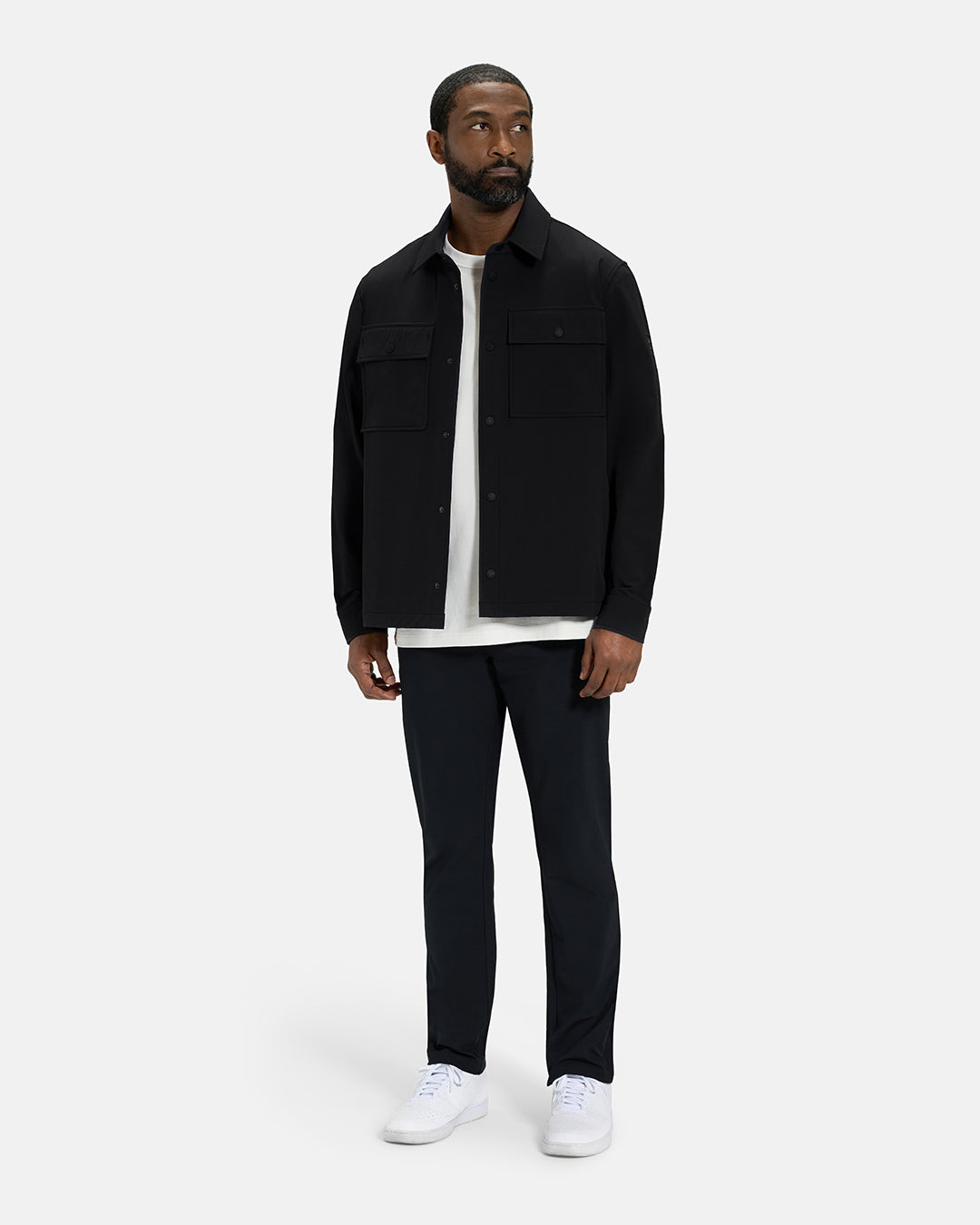 Full Body View of Black Spectator Collared Shirt Jacket on Black Male Model wearing white tee black pants and white shoes #color_black