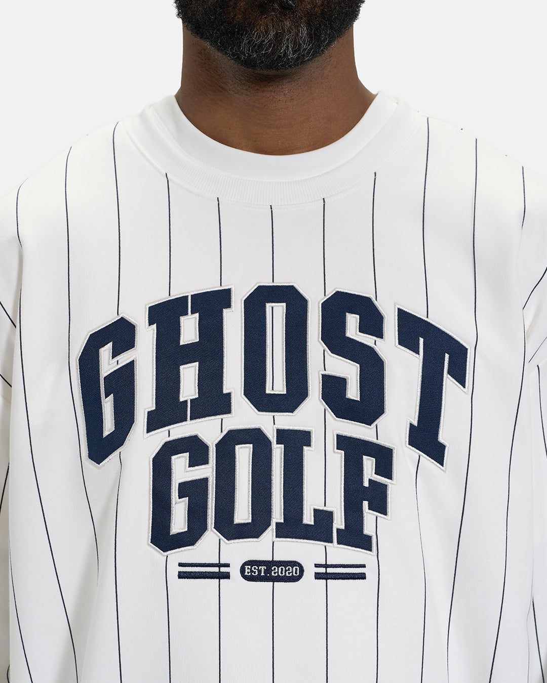 Front Closeup View of White Spectator Crew Sweatshirt on Black Male Model with Ghost Golf #color_white