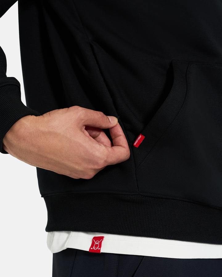 Side Closeup View of Black Spectator Dormie Hoodie on Asian Male Model pulling on zipper #color_black