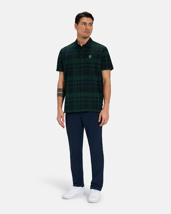Full Body Front View of Bogey Green Spectator Plaid Polo on Asian Male Model wearing navy pants and white shoes #color_bogey-green