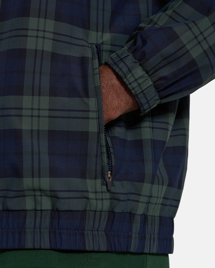 Pocket Closeup View of Plaid Dark Navy Spectator Reversible Jacket on Black Male Model with hand in pocket #color_plaid-navy