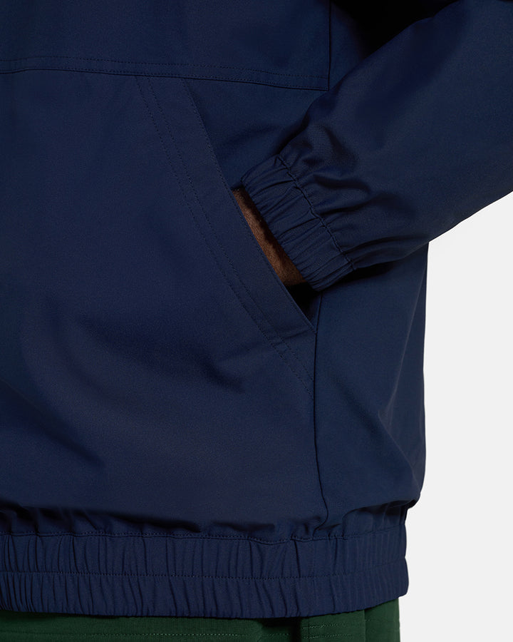 Closeup Side View of Plaid Navy Spectator Reversible Jacket on Black Male Model with hand in pocket #color_plaid-navy