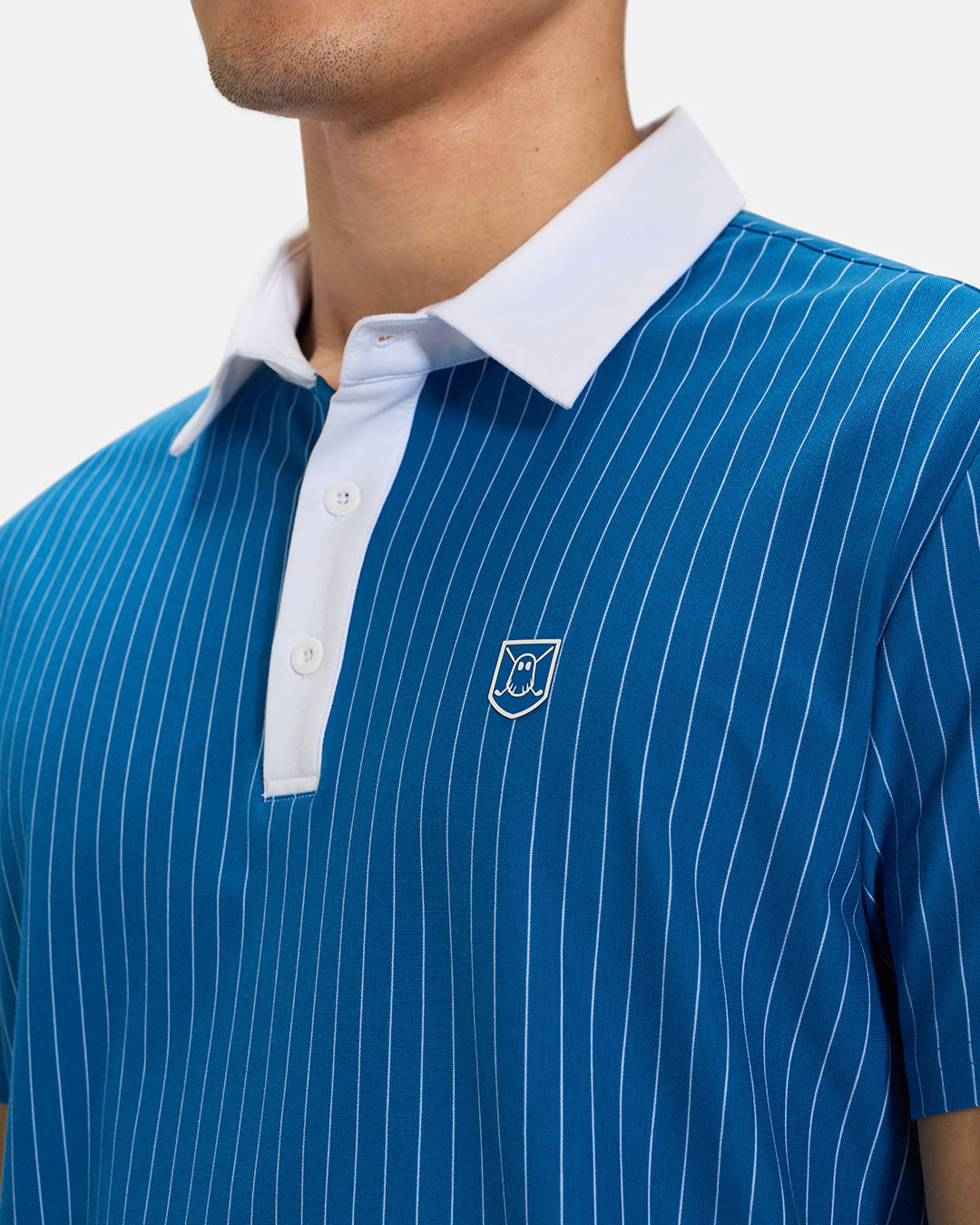 Front Closeup View of Royal Blue Spectator Stripe Polo on  Asian Male Model with Ghost Icon Crest #color_royal-blue