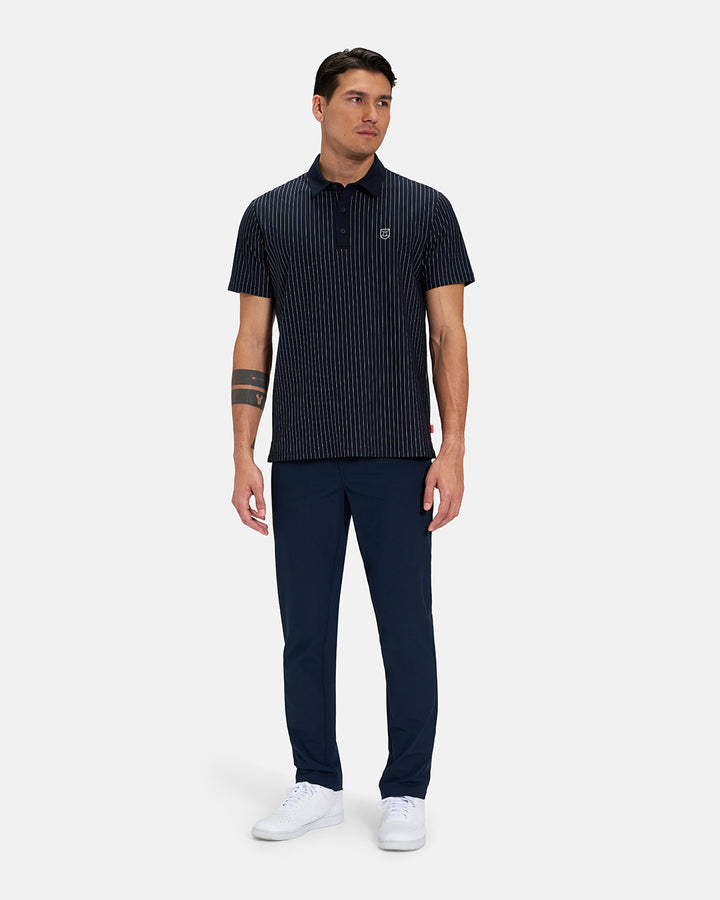 Full Body Front View of Navy Spectator Stripe Polo on Asian Male Model wearing navy pants and white shoes #color_navy