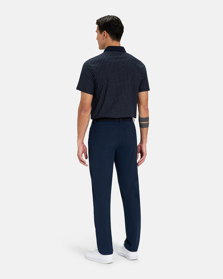 Full Body Back View of Navy Spectator Stripe Polo Tucked on Asian Male Model wearing navy pants black belt and white shoes #color_navy
