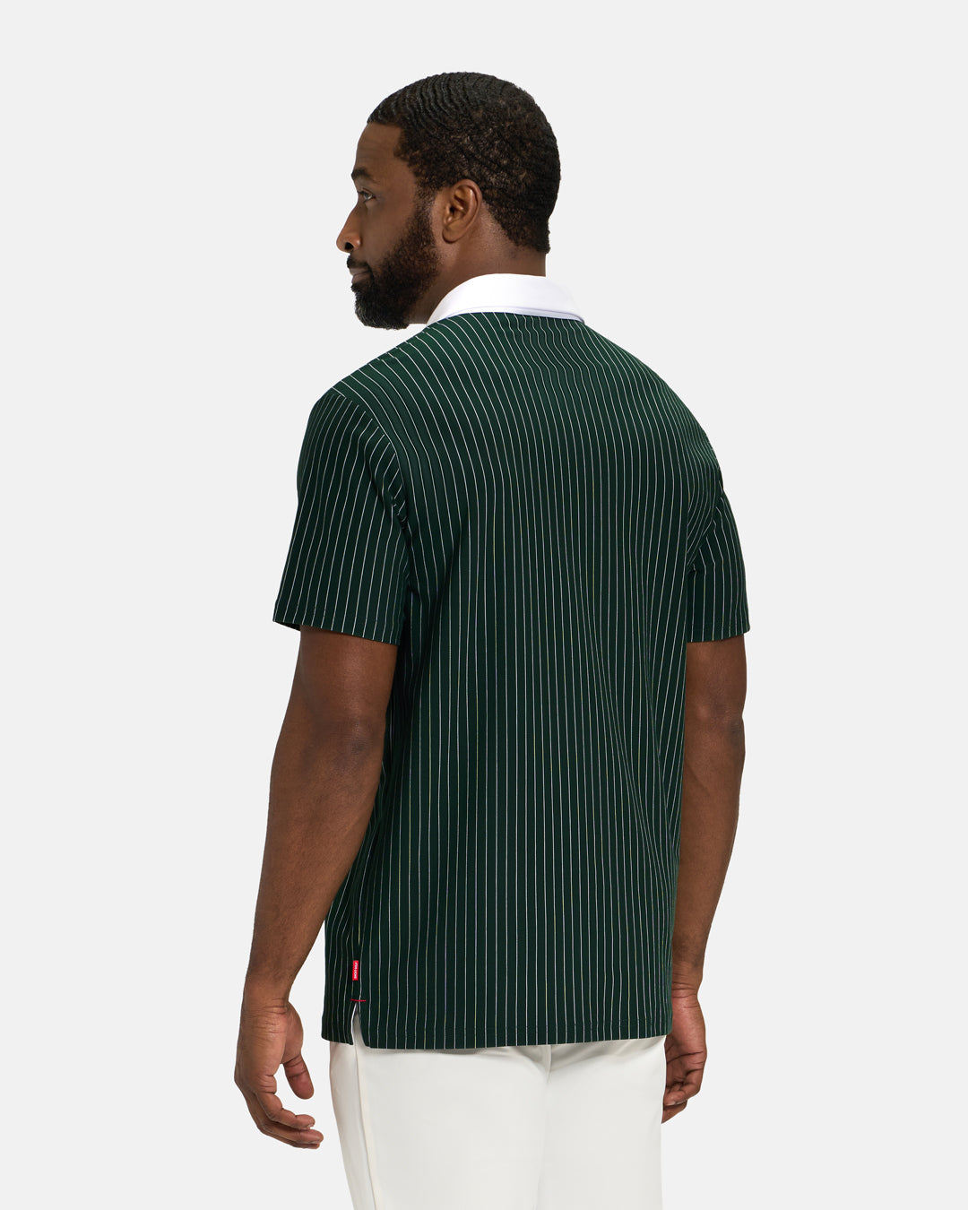 Back View of Bogey Green Spectator Stripe Polo on Black Male Model #color_bogey-green