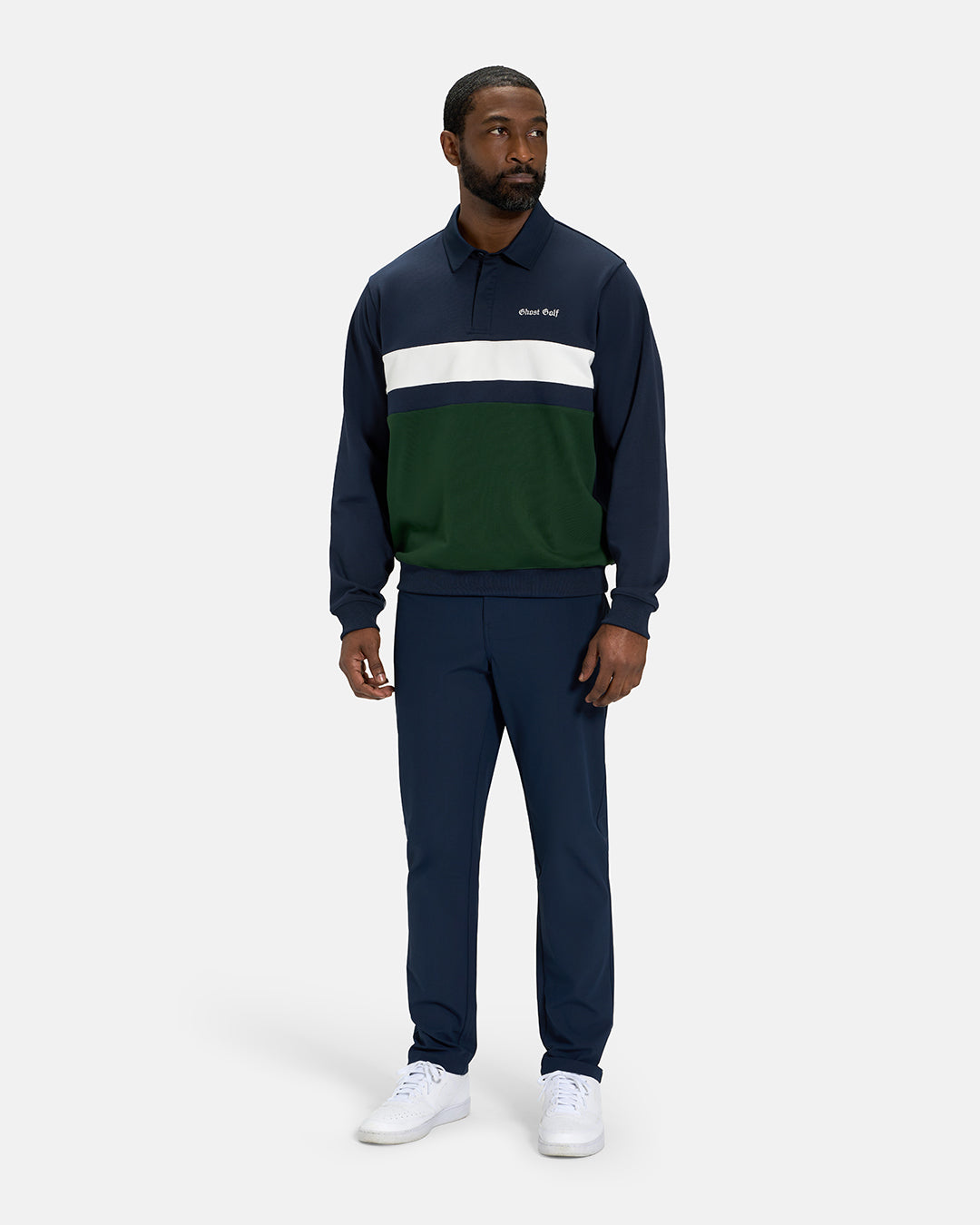 Full Body View of Navy Spectator Sweatshirt Polo on Black Male Model wearing navy pants and white shoes with Ghost Golf #color_navy