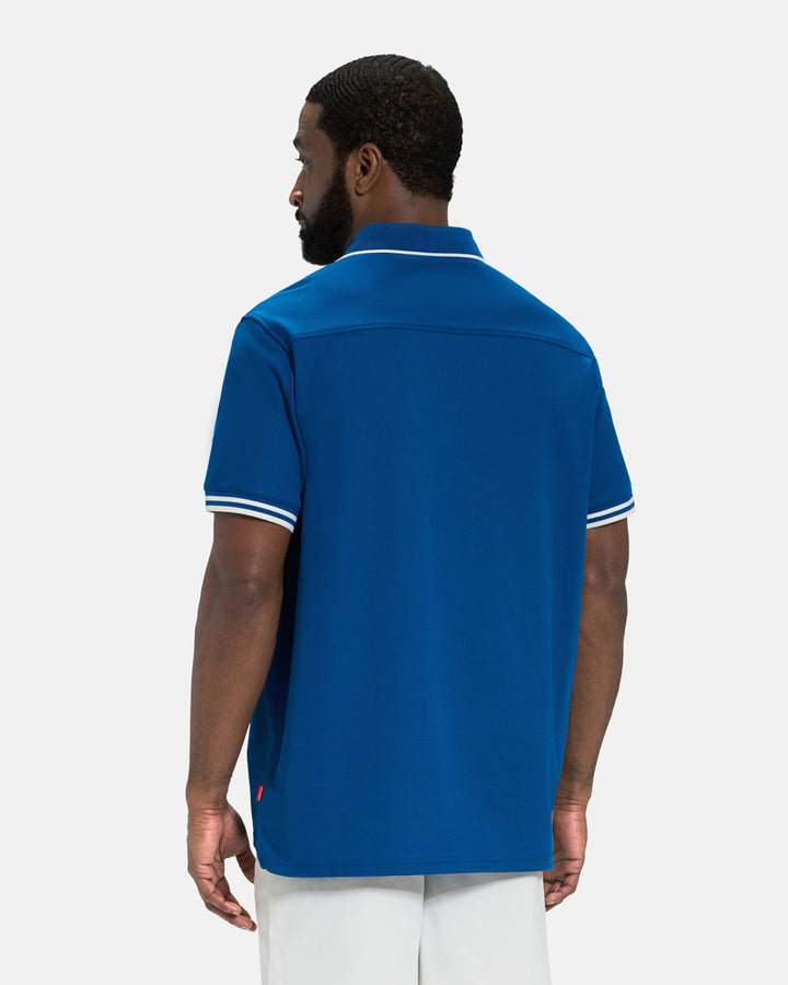 Back View of Royal Blue Spectator Tipped Collar Polo on Black Male Model #color_royal-blue