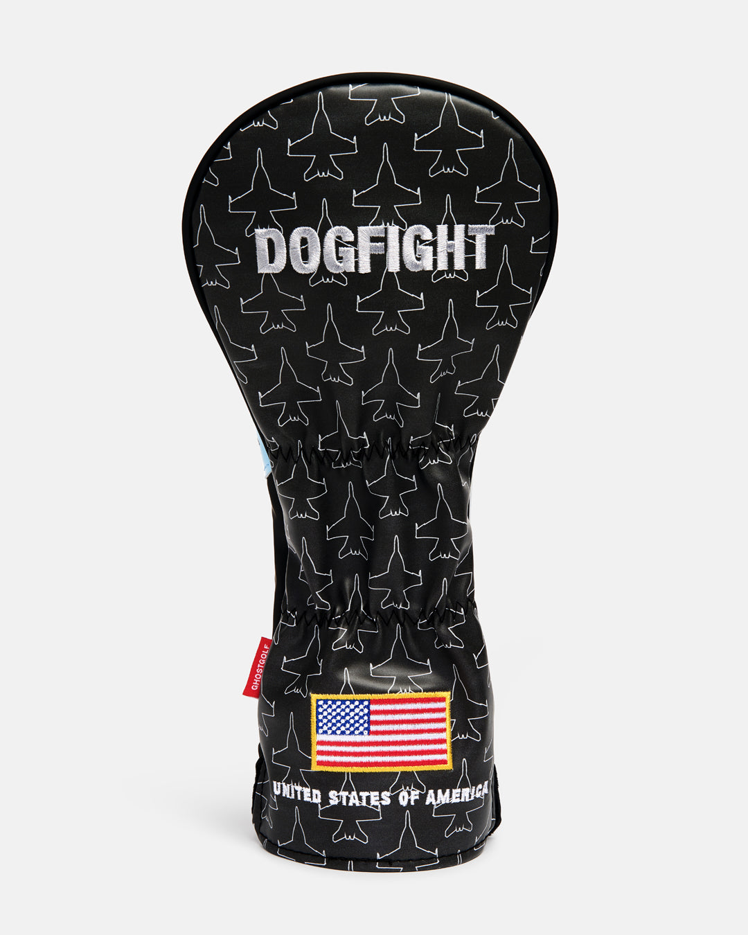 Back product shot of the Striker Secondary 3 Wood Head Cover showcasing an all-over fighter jet icon pattern. Features "Dogfight" embroidery at the top and an embroidered USA flag at the bottom with "United States of America" text beneath it. Rear-facing view highlighting the aviation-inspired graphics, premium embroidery, and patriotic Ghost Golf design details. #size_5-wood