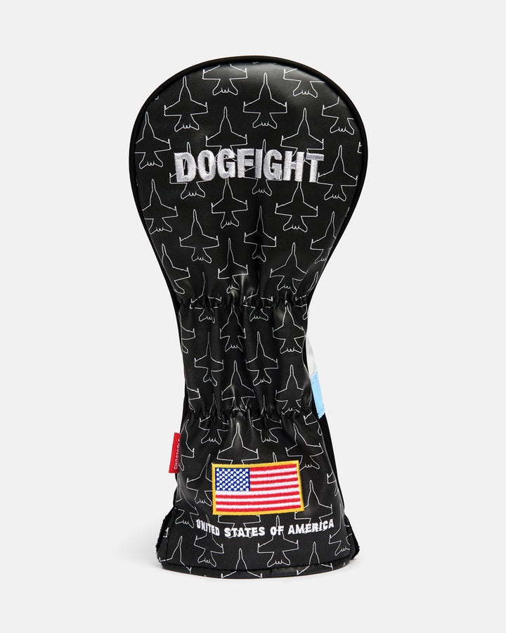 Back product shot of the Striker Secondary 5 Wood Head Cover showcasing an all-over fighter jet icon pattern. Features "Dogfight" embroidery at the top and an embroidered USA flag at the bottom with "United States of America" text beneath it. Rear-facing view highlighting the aviation-inspired graphics, premium embroidery, and patriotic Ghost Golf design details. #size_3-wood